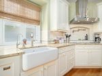 Farmhouse sink and custom cabinets adorn this beautiful kitchen 